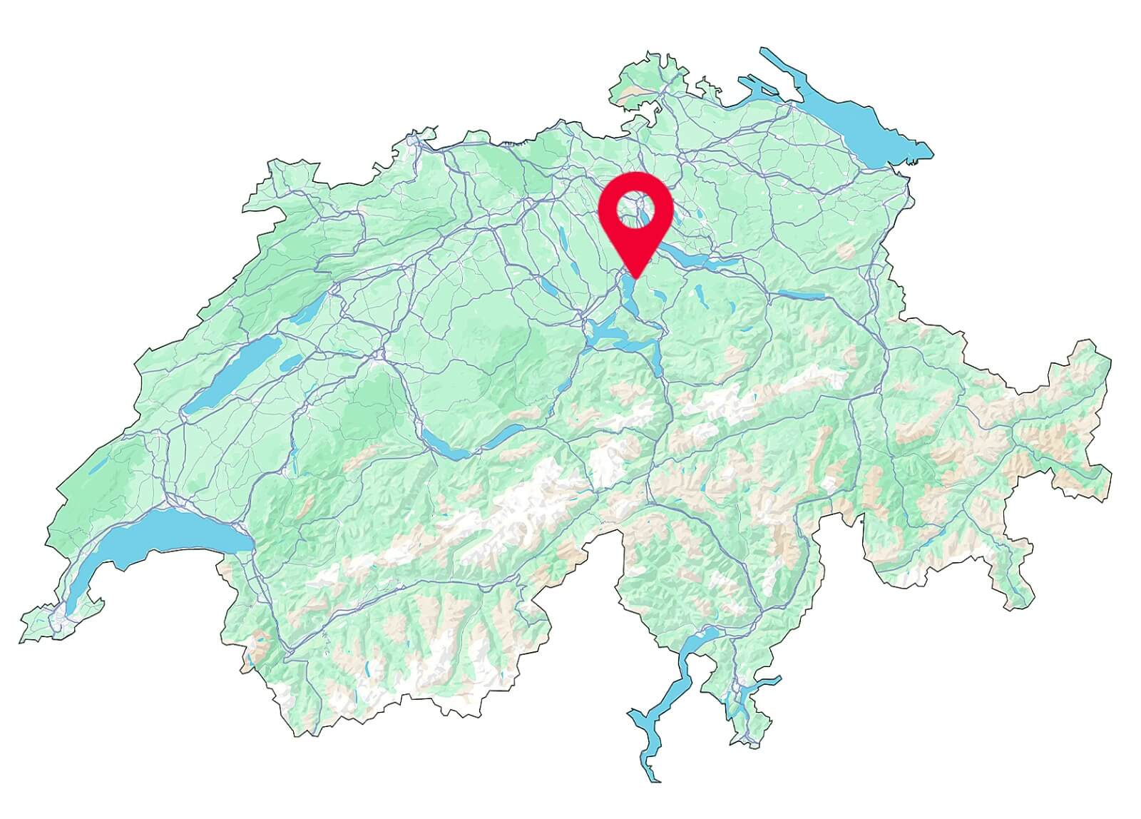 Ein junger Fahrschüler sitzt lächelnd am Steuer eines Fahrschulautos mit dem Logo der Fahrschule SULI, im Hintergrund ist die Stadt Zug mit ihren typischen Gebäuden und dem Zugersee zu sehen. Das Wetter ist sonnig, die Atmosphäre freundlich und einladend.